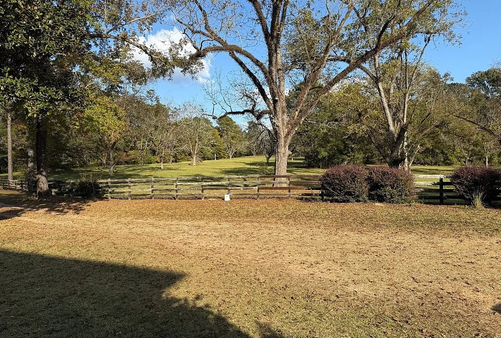 Double porch love! Pretty setting! On 16 acres in Alabama. $524,900