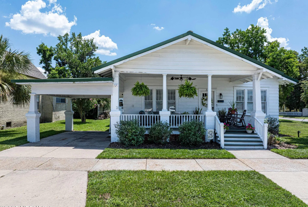 Great porch and a pretty interior! Circa 1926 in Florida. $275,000