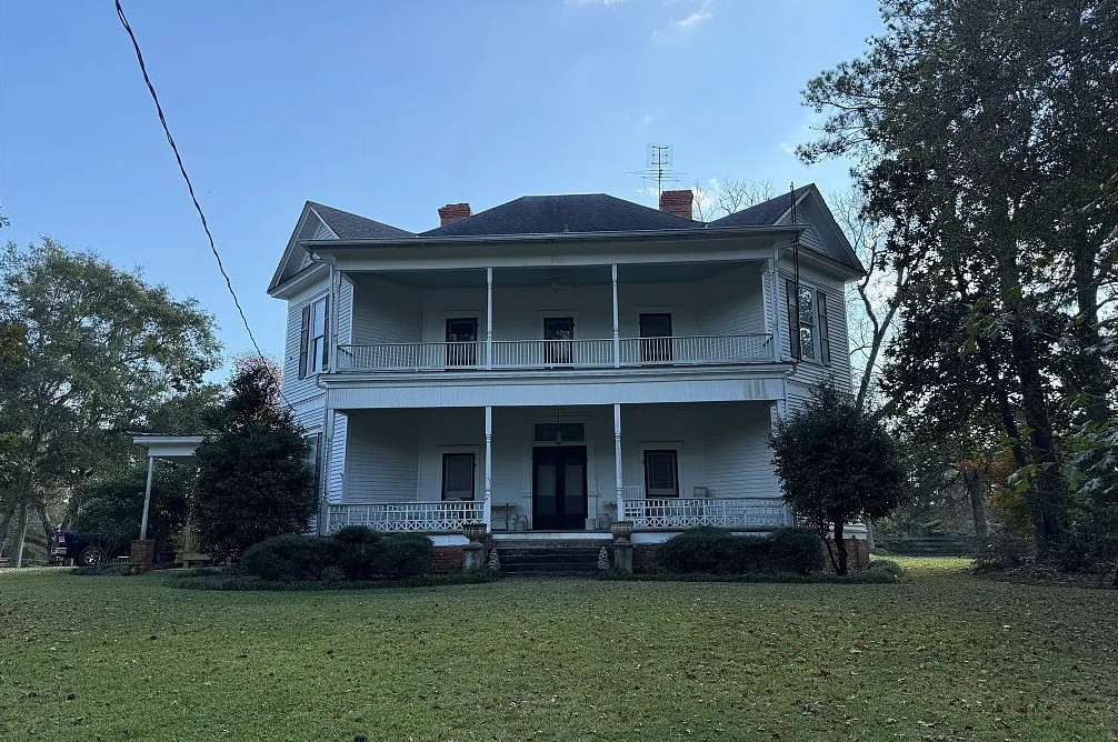 Double porch love! Pretty setting! On 16 acres in Alabama. $524,900