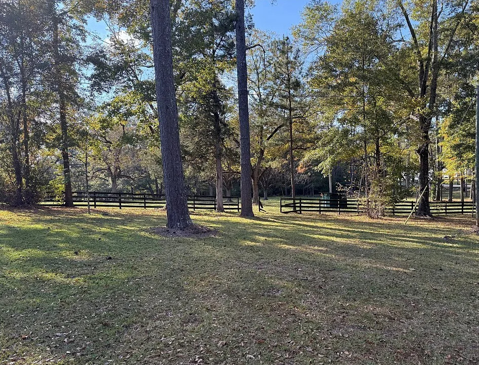 Double porch love! Pretty setting! On 16 acres in Alabama. $524,900