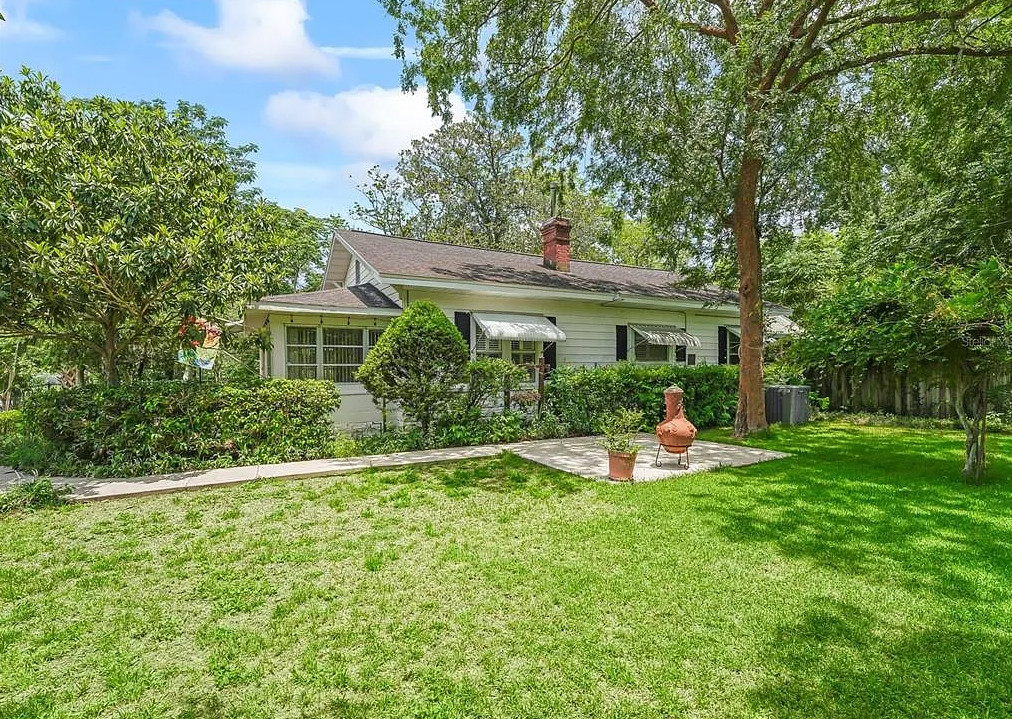 Backyard oasis! Nice fireplace in kitchen! C. 1930 in Florida. $185,000