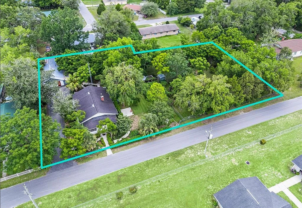 Backyard oasis! Nice fireplace in kitchen! C. 1930 in Florida. $185,000