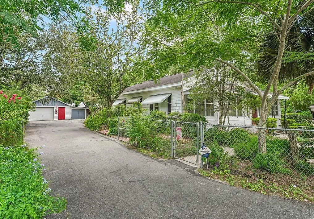 Backyard oasis! Nice fireplace in kitchen! C. 1930 in Florida. $185,000