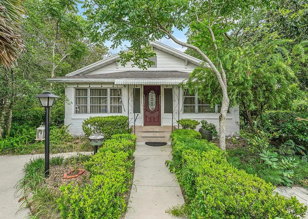 Backyard oasis! Nice fireplace in kitchen! C. 1930 in Florida. $185,000