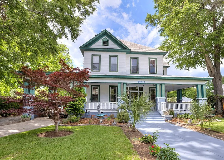 Has a pool, putting greens and a koi pond! C. 1925. Over an acre in SC. $334,500