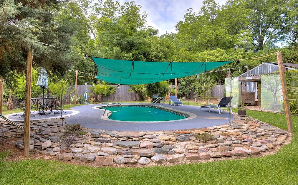Has a pool, putting greens and a koi pond! C. 1925. Over an acre in SC. $334,500