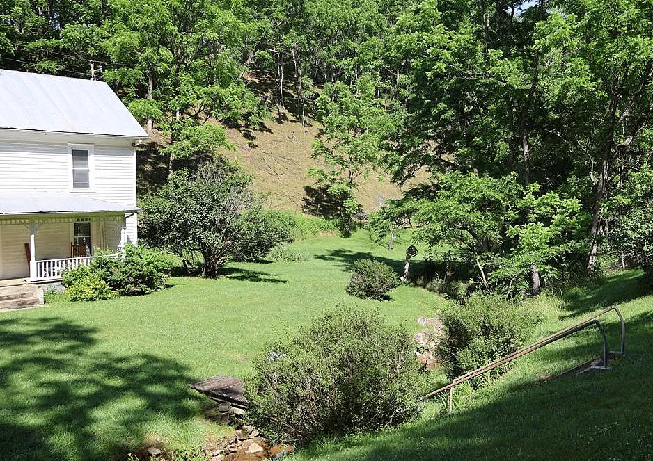 Such a pretty setting! Over five acres in Virginia with fruit trees. $299,900