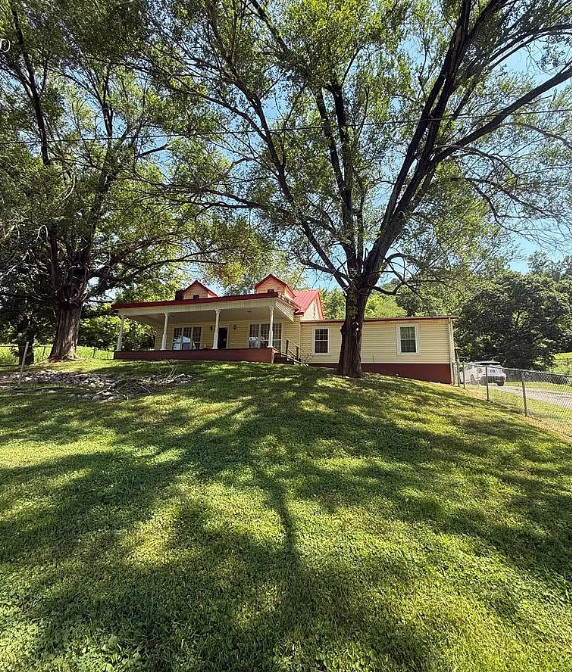 Nice porch and trees! Ten acres in Kentucky. $189,000