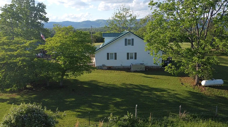 Pretty setting! Ten minutes to Mt. Airy, NC. Over an acre in Virginia. $172,500