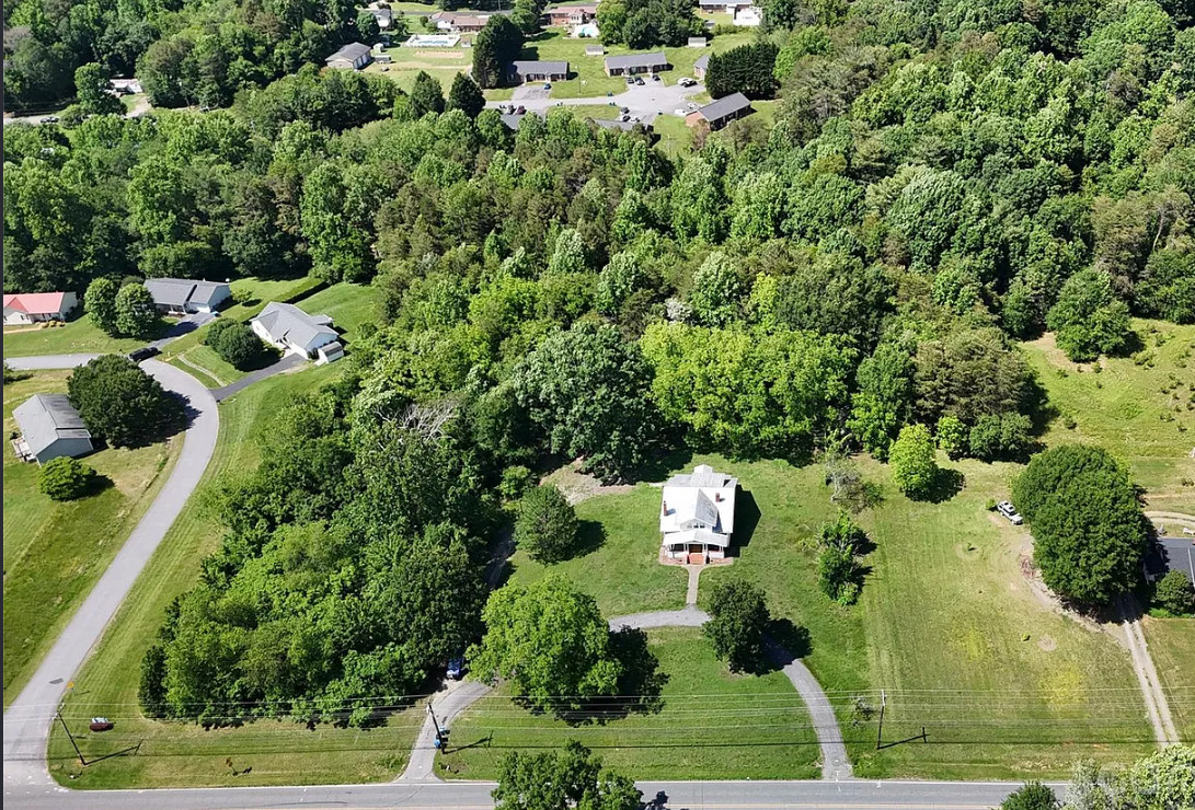 So much potential! Circa 1921. Over seven acres in North Carolina. $350,000