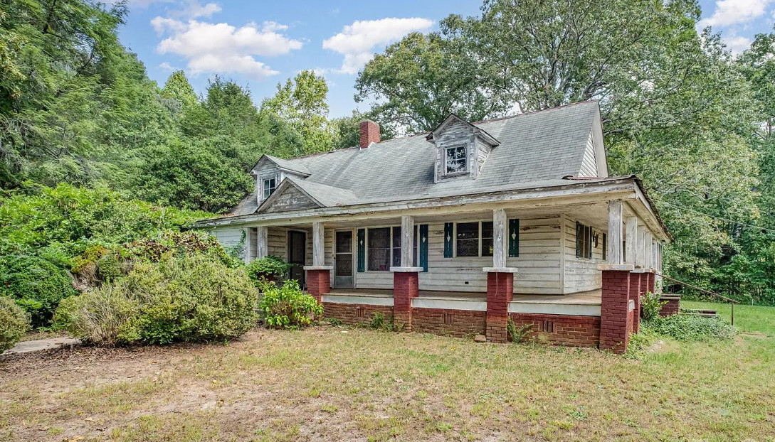 Eight acres! Fixer upper alert in North Carolina. $112,000
