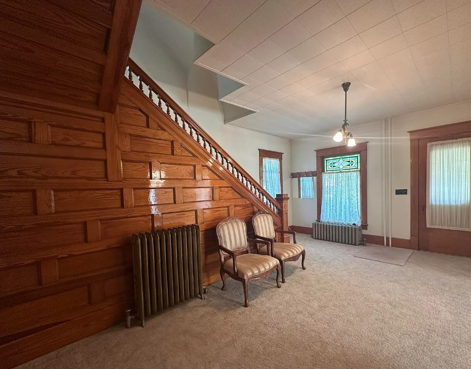 Diamond in the Rough! Pretty stairs, stained glass and pocket doors! C. 1905 in Nebraska. $147,500