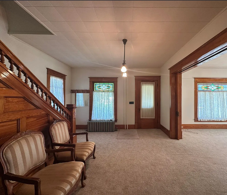 Diamond in the Rough! Pretty stairs, stained glass and pocket doors! C. 1905 in Nebraska. $147,500
