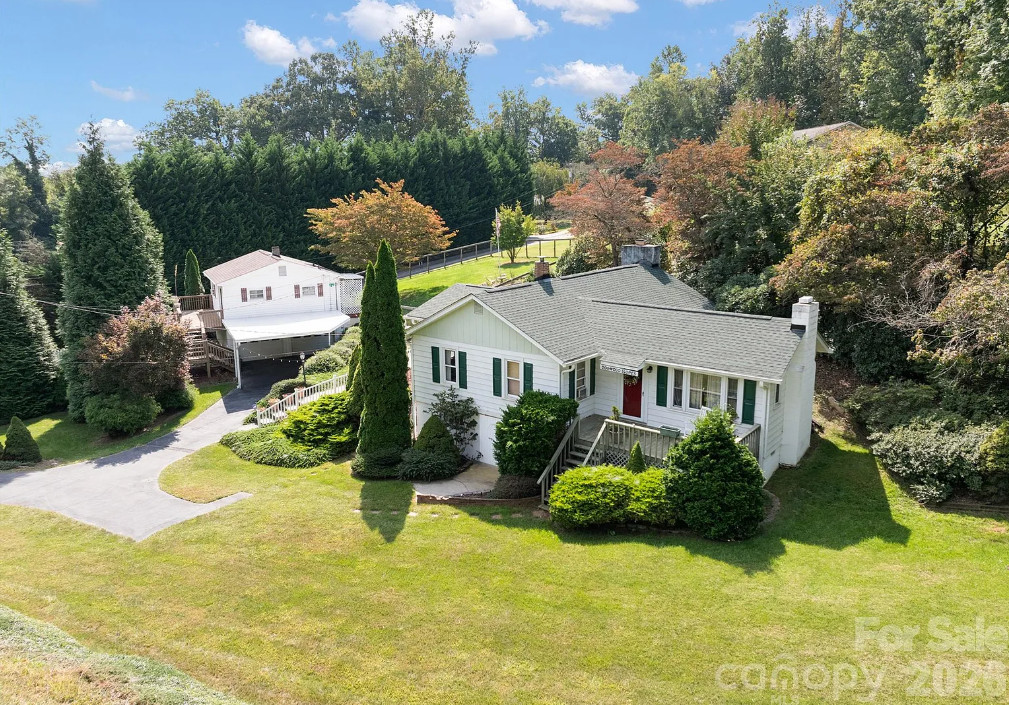 TWO houses. Pretty landscaping! “Dogwood Slopes”, C. 1948 in North Carolina. $389,000
