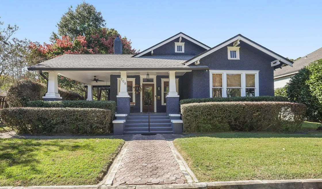 Porch goals! Nice bathrooms! Pretty interior! C. 1910 in Florida. $350,000