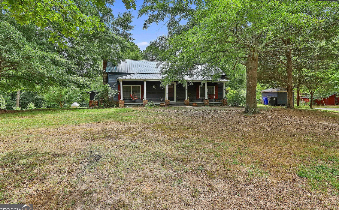 Interesting interior! Two barns! Over four acres in Georgia. $299,900