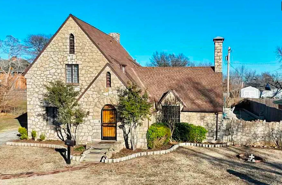 Stone house with a large in-ground pool! Circa 1928 in Oklahoma. $199,000
