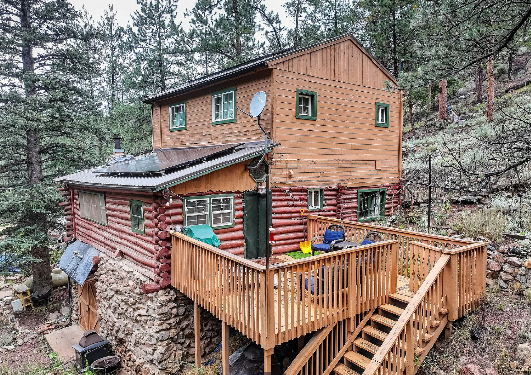 Stove is beautiful! Nice cabin in Colorado. Circa 1905. $389,000