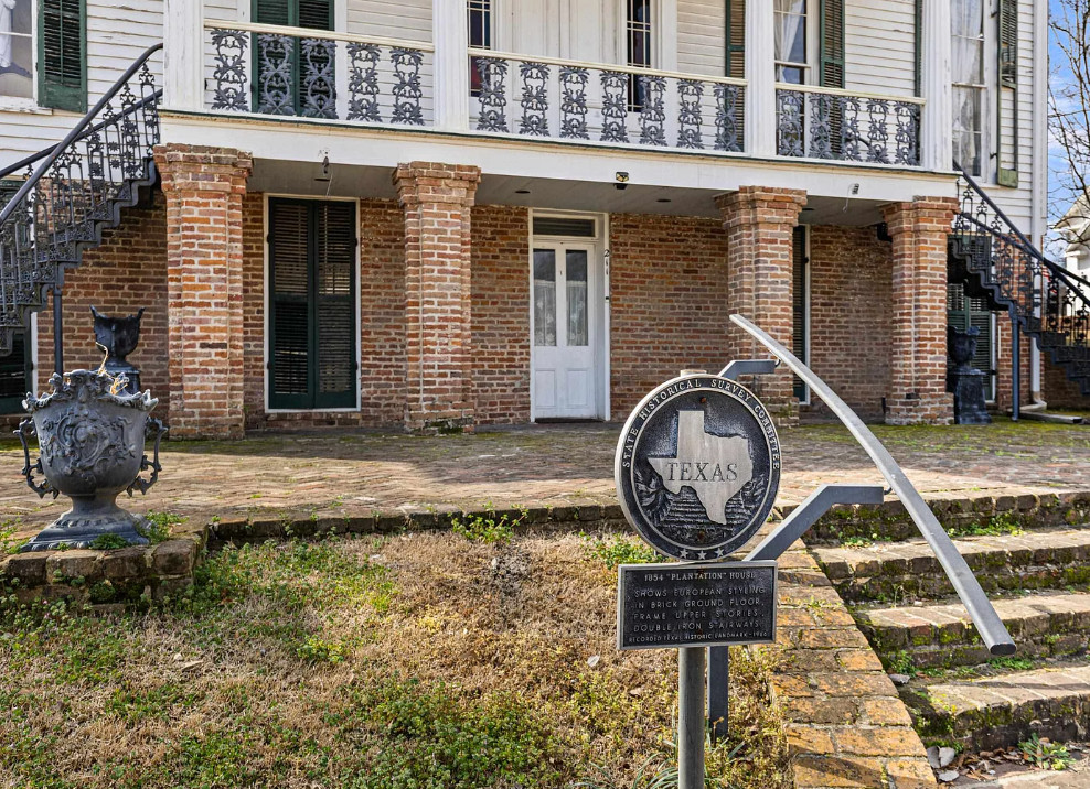 Interesting Greek Revival Raised Cottage in Texas! Love the brick flooring! $624,900