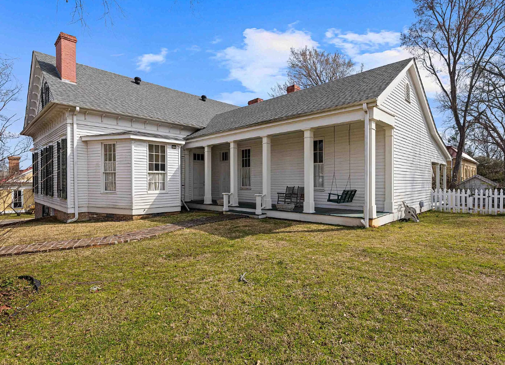 Interesting Greek Revival Raised Cottage in Texas! Love the brick flooring! $624,900