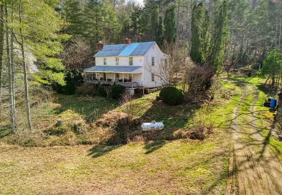Pretty setting! Almost 15 acres in Virginia. Old country store on the property. $229,900