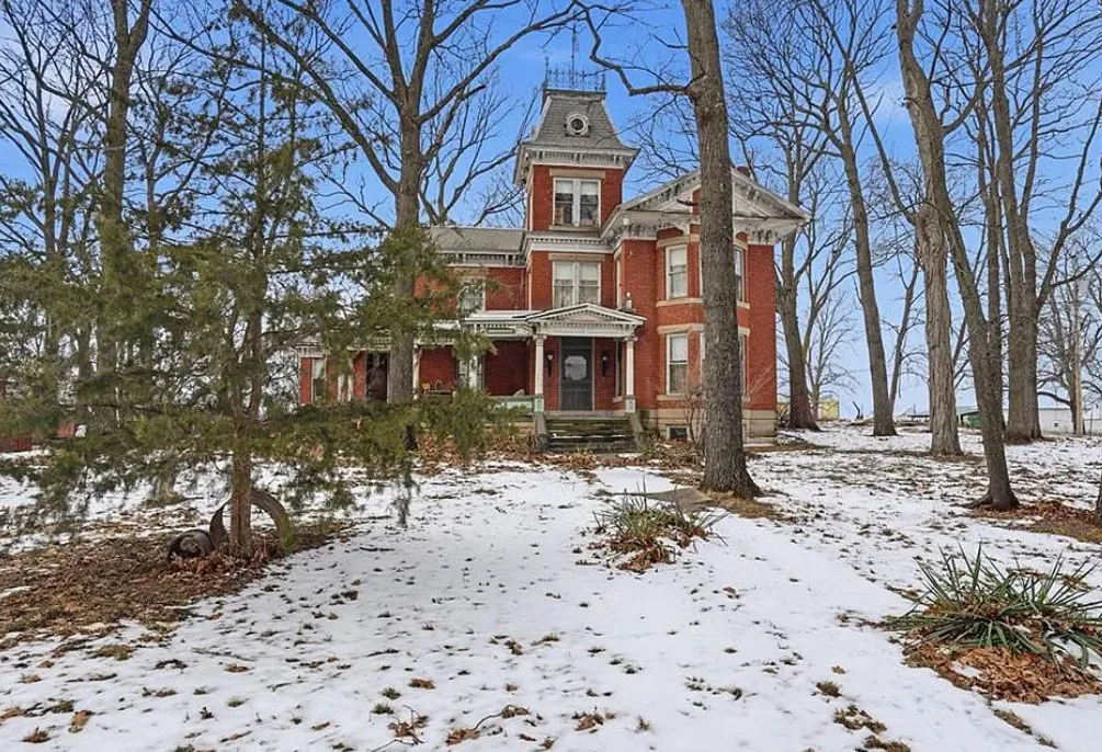 That staircase! I love this house and property! Over two acres in Missouri. $295,000