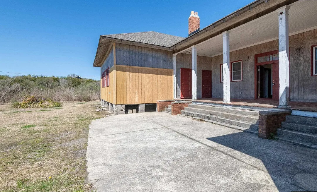 30 minutes to the beach! Former school. Love the stage with original seating! Over two acres in NC. $375,000