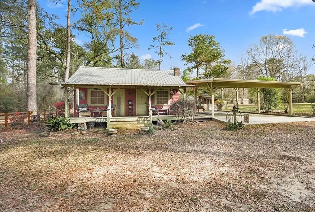 Nice outdoor fireplace! Citrus trees on the property. On 20 acres in Louisiana. $425,000