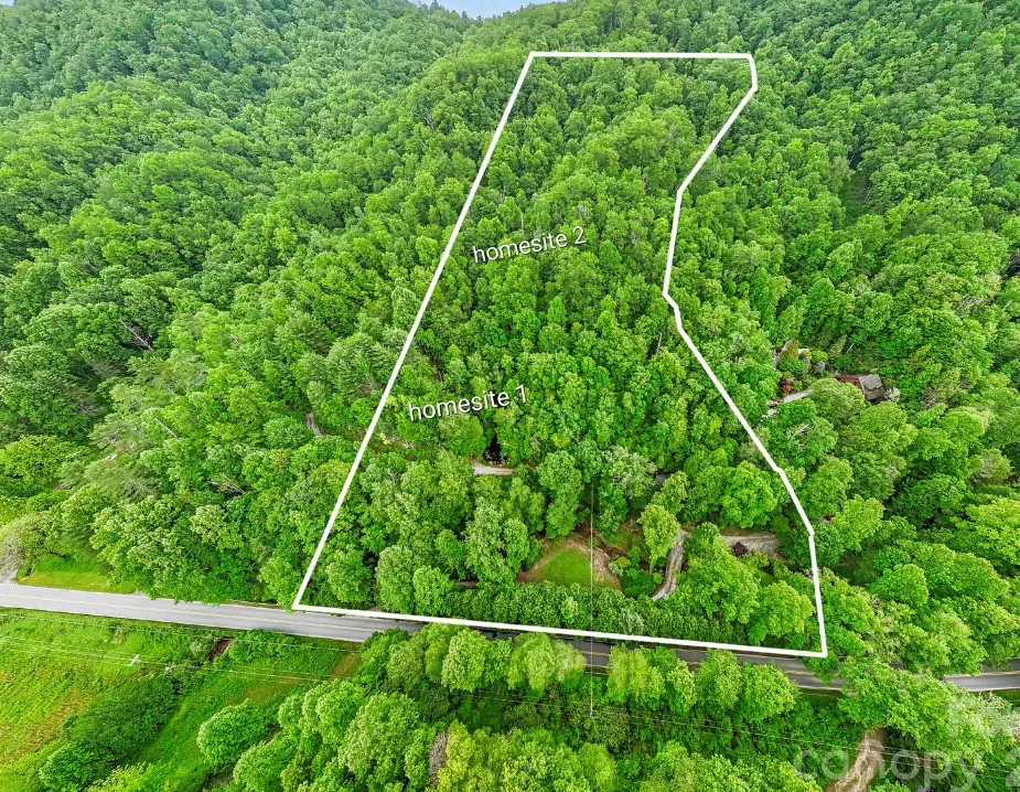 Beautiful setting! Pretty log cabin! Almost 12 acres in North Carolina. $499,000