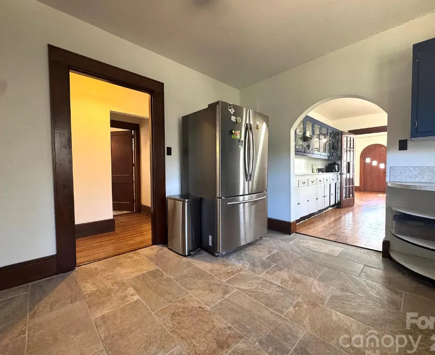 Stone cottage with rolled eaves! Over an acre in North Carolina. $225,000