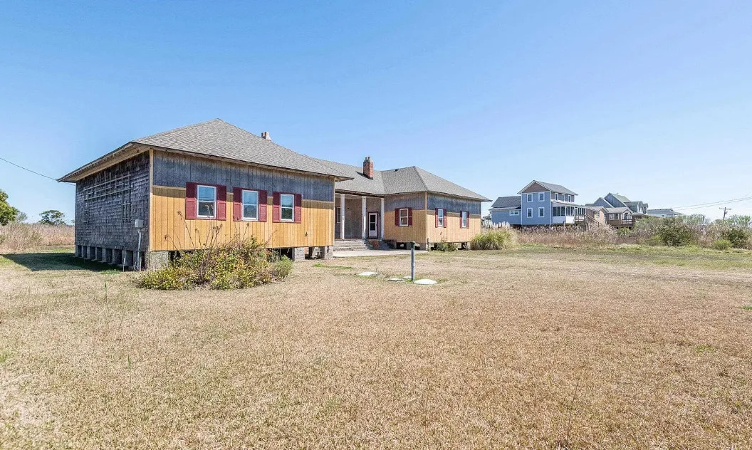 30 minutes to the beach! Former school. Love the stage with original seating! Over two acres in NC. $375,000