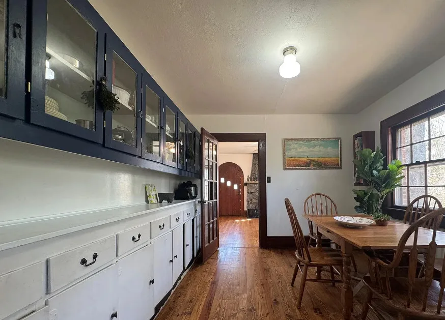 Stone cottage with rolled eaves! Over an acre in North Carolina. $225,000