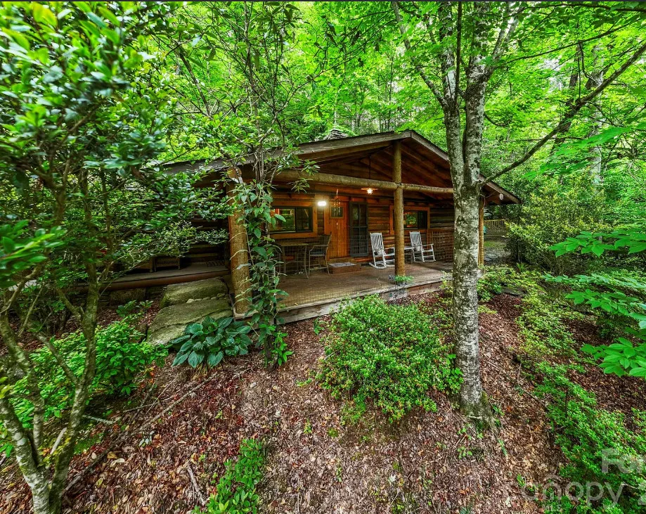 Beautiful setting! Pretty log cabin! Almost 12 acres in North Carolina. $499,000