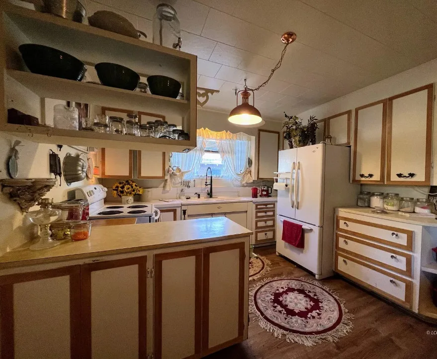 Great wrought iron fence! Pretty mantel! Circa 1940 in Oregon