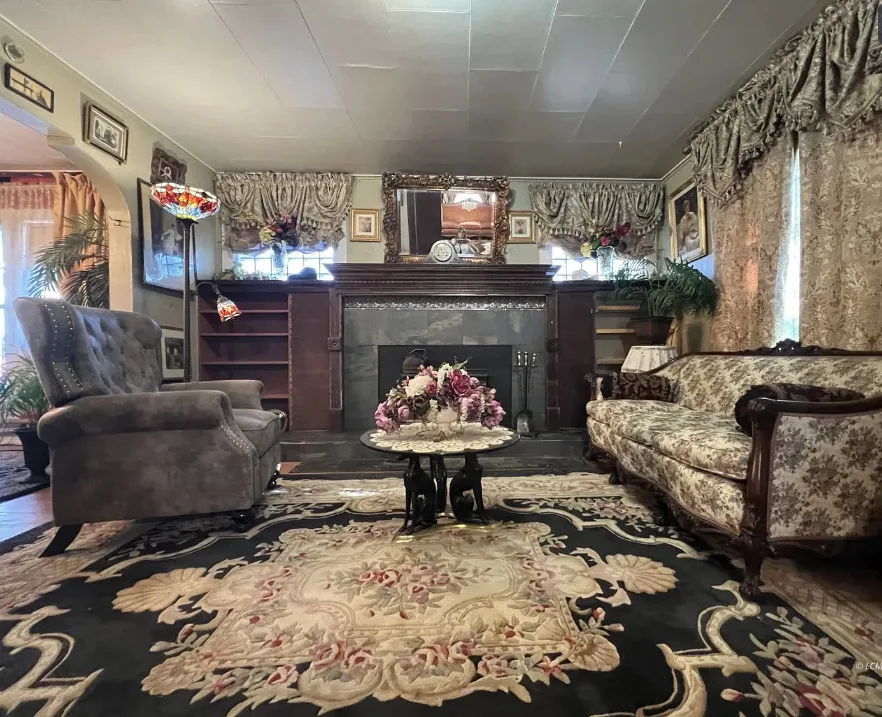 Great wrought iron fence! Pretty mantel! Circa 1940 in Oregon