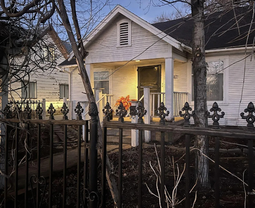 Great wrought iron fence! Pretty mantel! Circa 1940 in Oregon