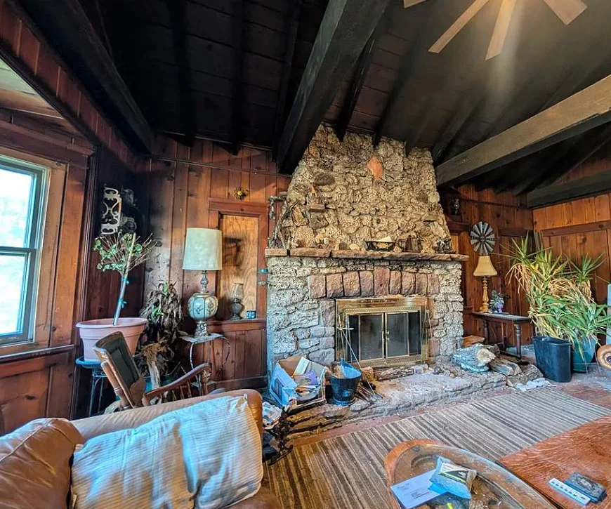 That stone fireplace! Diamond in the Rough! Four acres in Missouri.