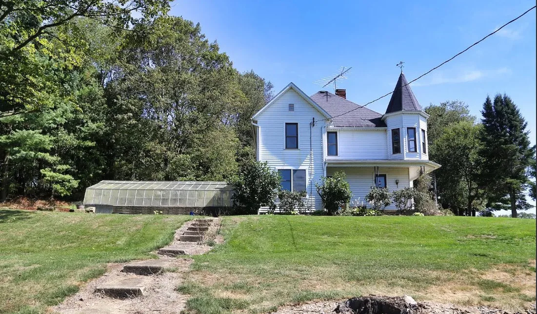 Nice woodwork! Attached greenhouse! One acre in Ohio. $250,000