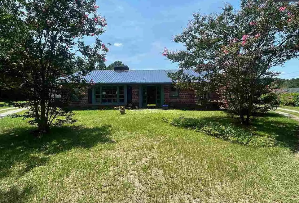 Love the beamed ceiling! Over an acre in South Carolina.