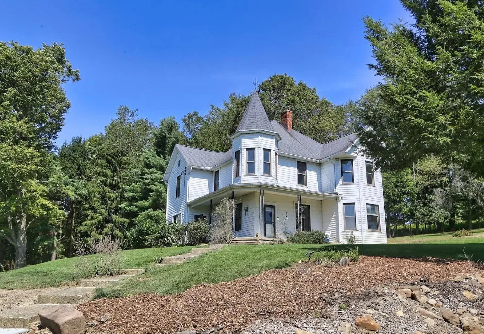 Nice woodwork! Attached greenhouse! One acre in Ohio. $250,000