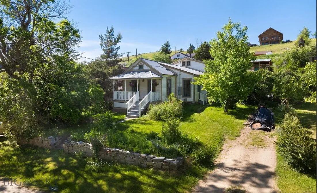 Great interior! That glass sunroom! That sink! C. 1900 in Montana. $445,000