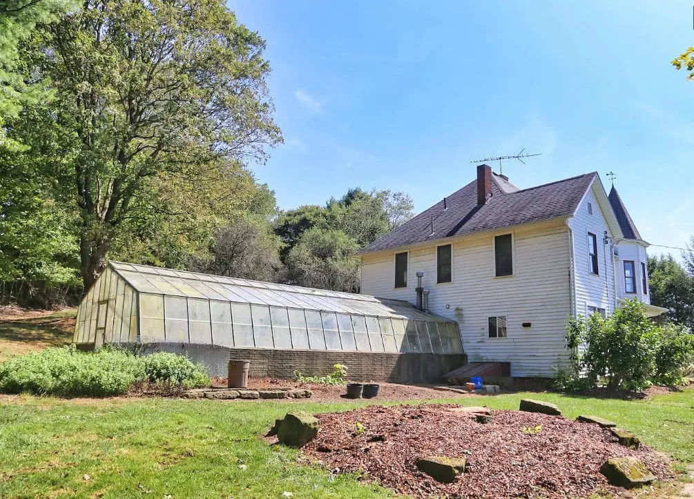 Nice woodwork! Attached greenhouse! One acre in Ohio. $250,000