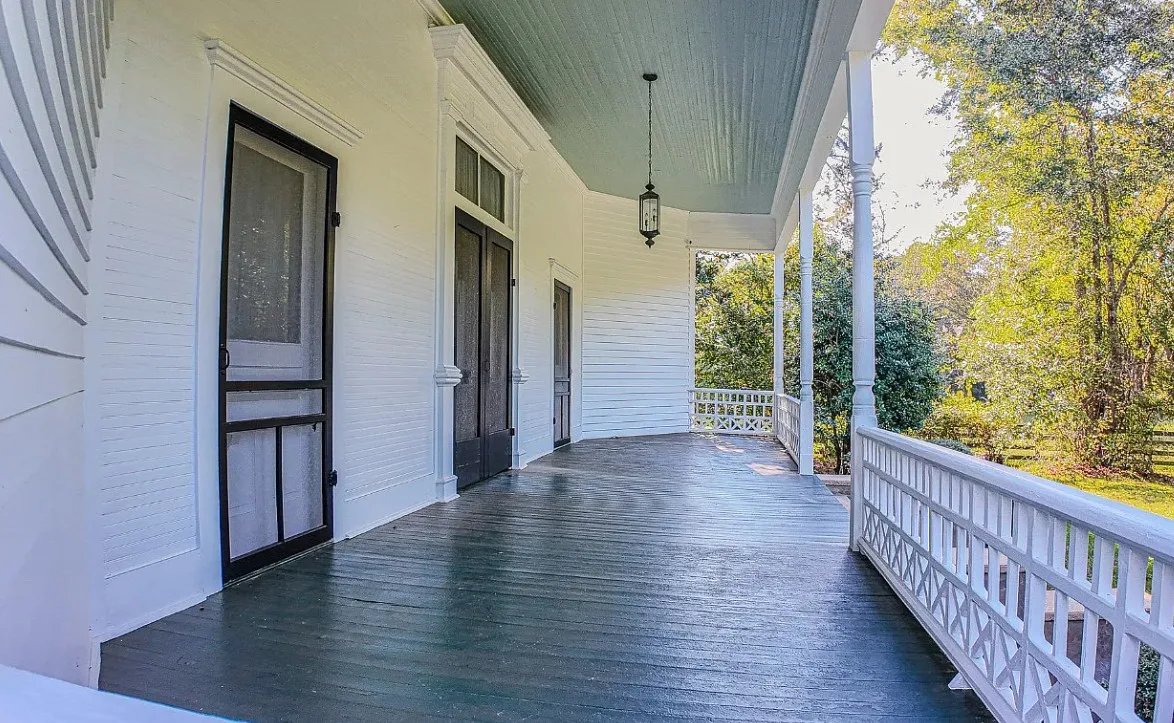 Double porch love! Pretty details! On 16 acres in Alabama.