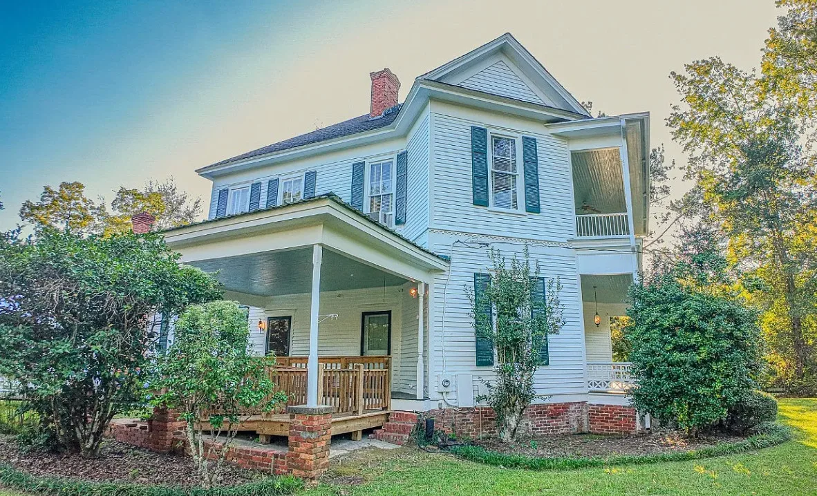 Double porch love! Pretty details! On 16 acres in Alabama.