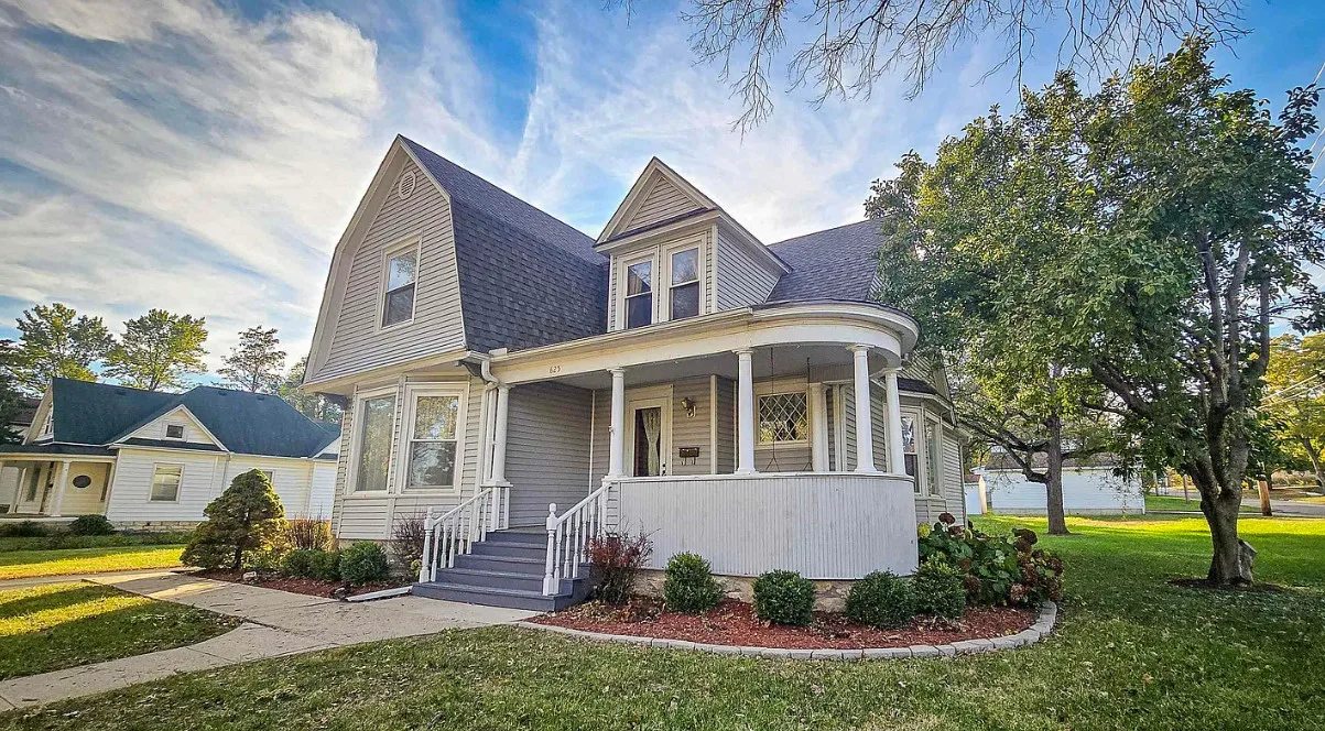 Unpainted woodwork! Pretty tree lined street! Circa 1910 in Kansas.