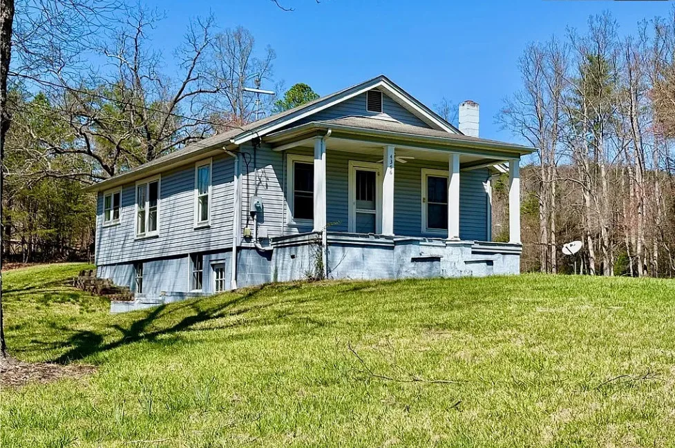 Want this! Love the outbuildings! What a nice retreat this would be! Almost five acres in NC.