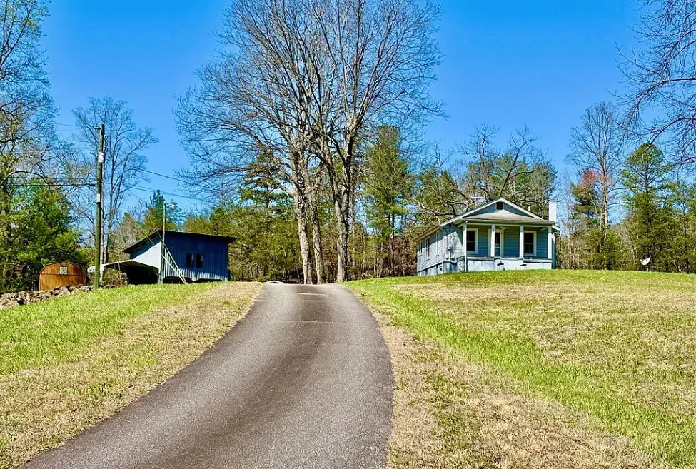 Want this! Love the outbuildings! What a nice retreat this would be! Almost five acres in NC.