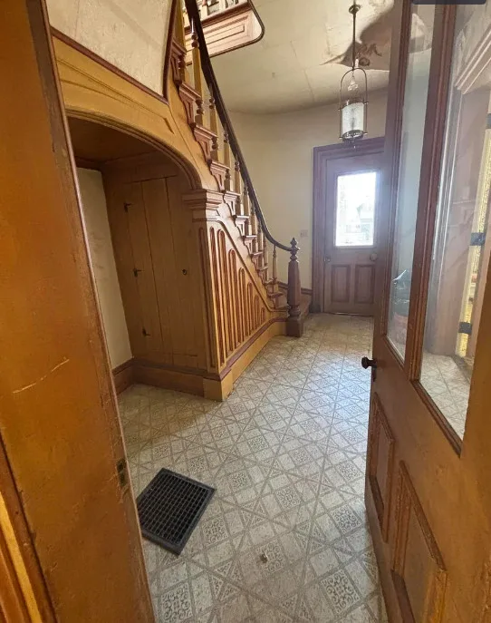 What a house this could be! Great staircase! C. 1885 in Michigan.