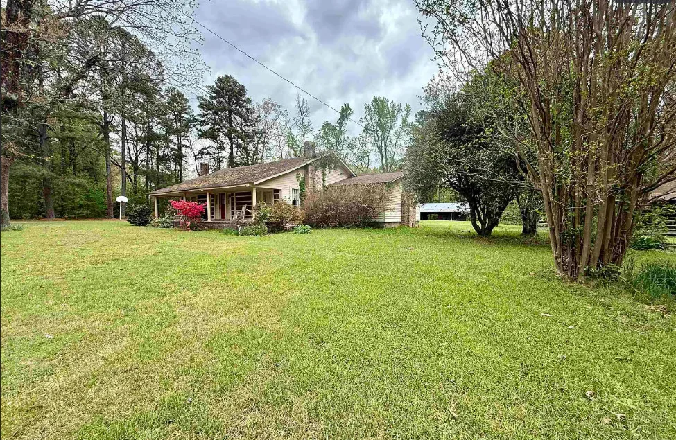 Potential! The Harveyville House. Over six acres in Arkansas.