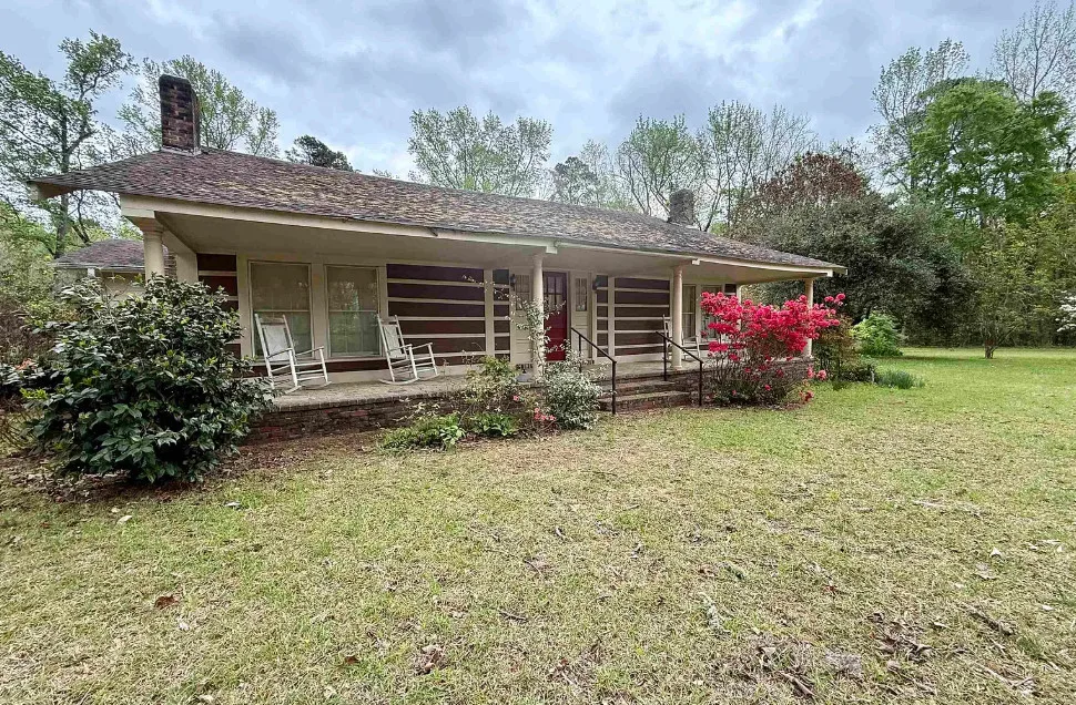 Potential! The Harveyville House. Over six acres in Arkansas.